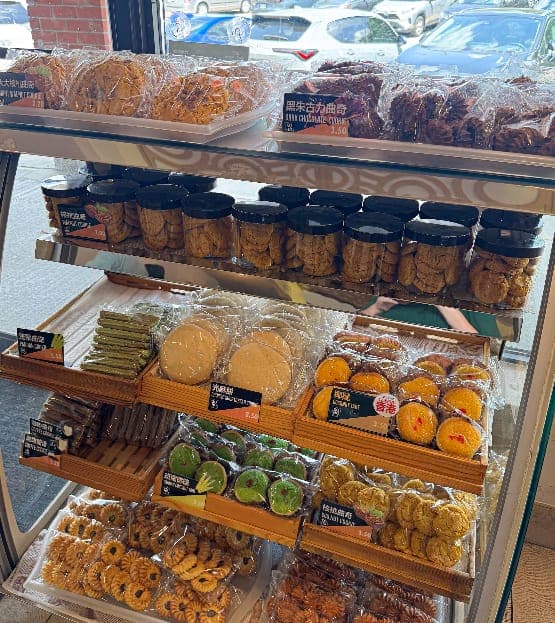 Shelves of cookies, tarts and jarred treats