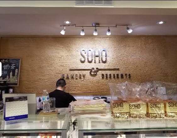 The front counter, milk tea board on the wall